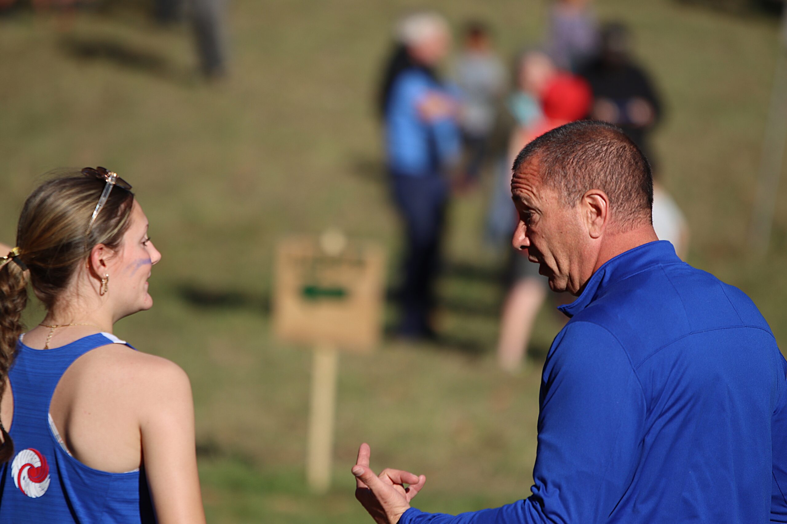 Coach Joe talking to a player