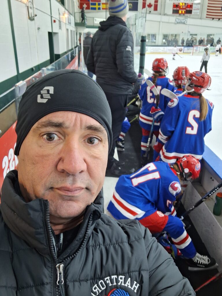 Joe with hockey athletes