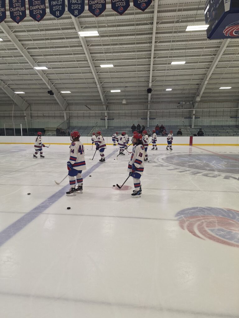 Hockey athletes center rink